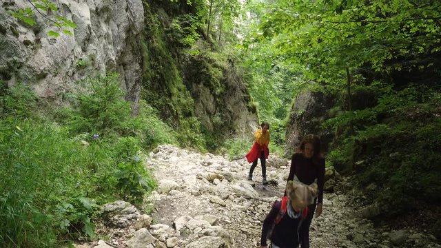 active family hiking by the Prapastiile Zarnestiului canyon, Piatra Craiului National Park, Romania