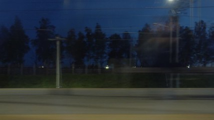 Freight cargo train moves past platform