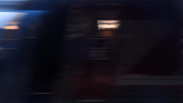 Train windows at night pass on high speed