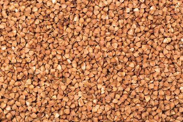 Macro Photo food buckwheat groats. Texture background grain buckwheat groats. Image food product porridge buckwheat grains