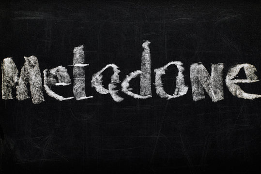 top view of black chalk board with lettering metadone