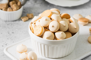 Butter cookies in a white vase on a light gray background