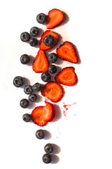 Blackberry and strawberry over white background. Close up, top view, high resolution product