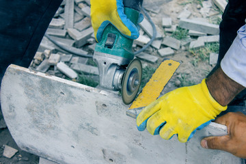 Manual worker work in factory with grinder