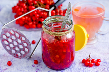 Viburnum berry with sugar in a glass jar