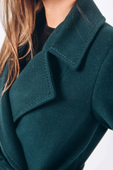 Details of women's clothing. Close-up of a collar of a female wool coat. winter clothes. warm...
