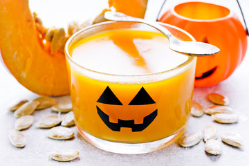 Pumpkin orange jelly or panna cotta in glass - fun and healthy idea for Halloween party dessert for...