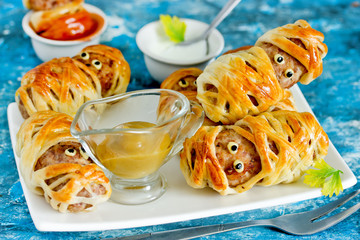 Halloween mummies - meatballs wrapped in dough with funny eyes , funny idea for halloween party...