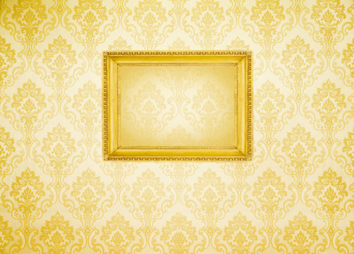 Gold frame  on the wall wallpaper thai the dark.