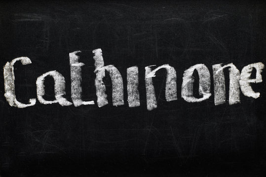 top view of black chalk board with lettering cathinone