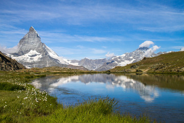 Matterhorn and Dente Blanche from Riffelsee mountain lake above Zermatt, Switzerland