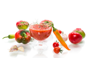 homemade hot adjika from tomatoes, hot and sweet peppers with spices
