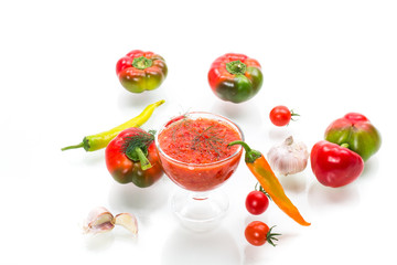 homemade hot adjika from tomatoes, hot and sweet peppers with spices