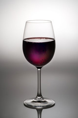 backlit red wine glass