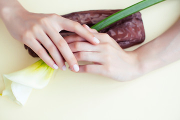 Naklejka premium pretty perfect woman hands with white manicure and little flowers on colorful background