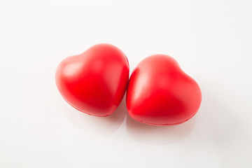 Two red heart shape isolated on white background