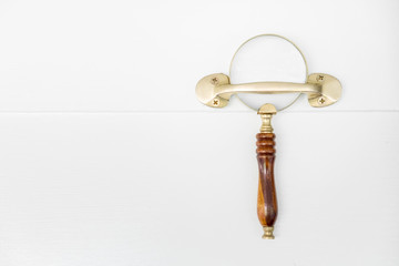 vintage magnifying lens hanging on the wall