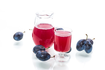 sweet compote of autumn blue plums isolated on white