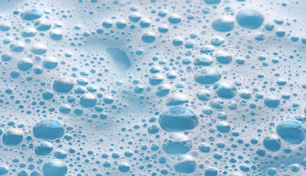 soap foam on blue background, bubbles macro