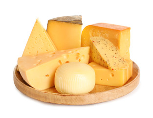 Wooden plate with different kinds of cheese on white background