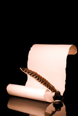 Unrolled papyrus scroll with inkwell and quill pen