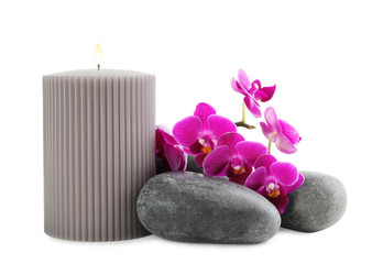Orchid with spa stones and candle on white background