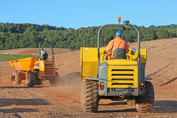 Dump trucks on a road construction site
