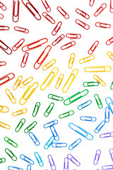 Fototapeta na wymiar Background of paperclips in rainbow colors