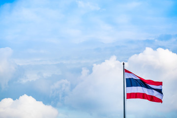 Thai flag of Thailand with blue sky background.