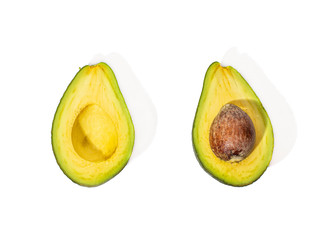 Two halves of avocado on an isolated background.