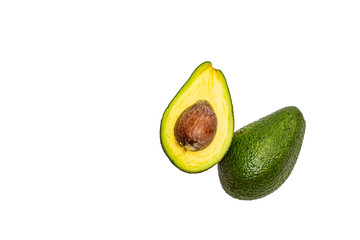 Two halves of avocado on an isolated background.