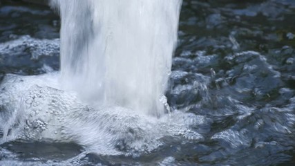 Video 4k of close up of small waterfall 