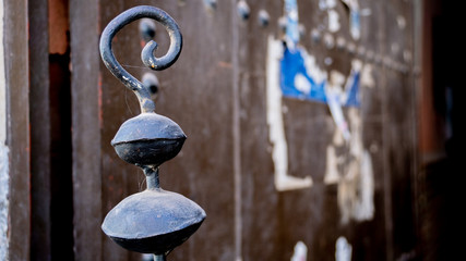 oriental iron in front of blurred background