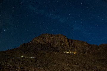 Fototapeta na wymiar Mount Moses at night. Starry sky and the Milky Way. Holy place for pilgrims and tourists. Mount Sinai, Egypt
