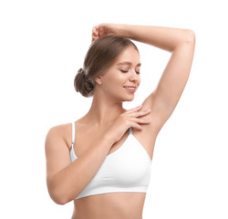Obraz premium Young woman with smooth clean armpit on white background. Using deodorant