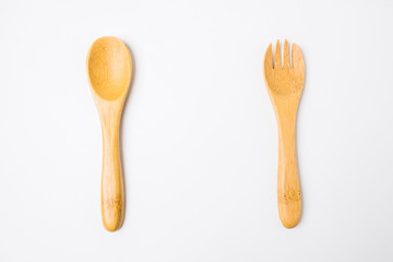 Wooden spoon and fork isolated on white