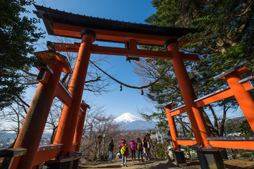 Fototapeta na wymiar Mt. Fuji with red pagoda in spring, Fujiyoshida, Japan