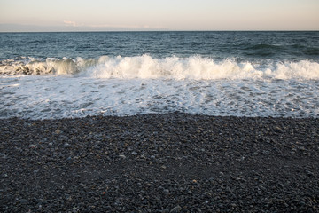 black sand beach with rock at Miho No Matsubara Beach, japan