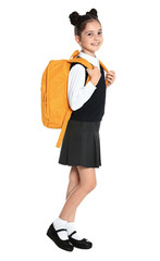 Happy girl in school uniform on white background