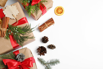 Composition with Christmas gifts on white background, top view