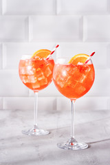 Refreshing Aperol Spritz cocktail with ice and slice of orange