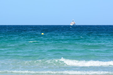 Turquoise and shallow waters of Muro Beach (Play de Muro) in the north of Mallorca, Spain