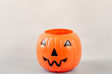Happy Halloween Day, Spooky day. Pumpkin trick or treat basket, orange pumpkins, scary metal house