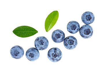 Blueberries with leaves on a white background, top view.