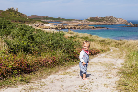 Portrait of girl standing on path of Little Bay Beach