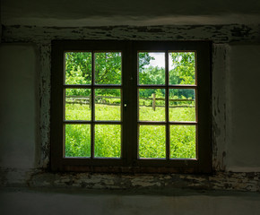 The window of an old farmhouse, inside