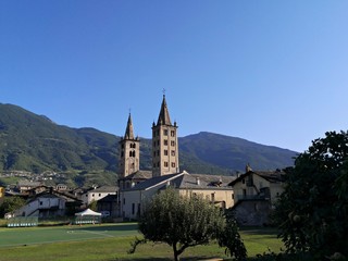 Fototapeta na wymiar Santa Maria Assunta Cathedral - bell towers in medieval city of Aosta, Italy