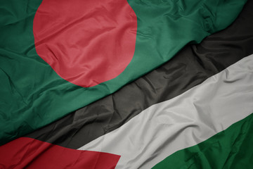 Obraz premium waving colorful flag of palestine and national flag of bangladesh.
