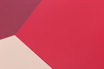 Paper light beige, burgundy, red empty background, geometrically located. Color blank for presentations, copy space.