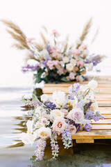 Sea wedding decor on the coast. Wedding ceremony near the water